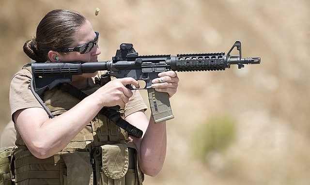 100714-N-4965F-174 DULZURA, Calif. (July 14, 2010) - Chief Mass Communication Specialist (SW) Paula Ludwick, assigned to Fleet Combat Camera Group Pacific, shoots her target during a Navy Rifle Qualification Course. The training prepares Sailors for upcom